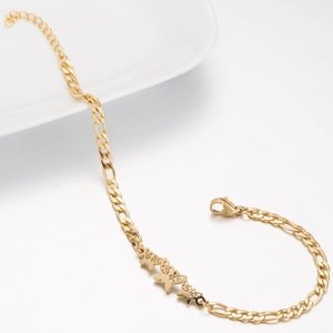 Close-up of gold Figaro chain necklace with three hollow butterfly pendants and lobster clasp