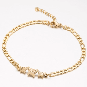 Detail view of a gold Figaro chain necklace with three hollow butterfly pendants