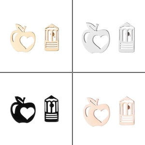 Detailed view of apple and pencil shaped stainless steel earrings in four metallic colors