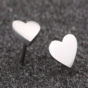Minimalist silver heart stud earrings for women featuring a polished metallic finish