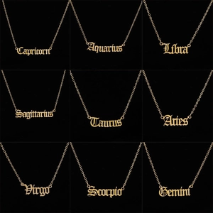 Gothic style gold constellation necklaces set with 12 zodiac signs on black background