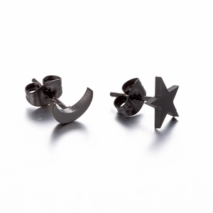 Detailed view of matte black asymmetrical star and moon stud earrings with butterfly backs