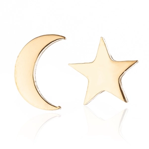 Detailed view of polished golden star and crescent moon stud earrings on white background