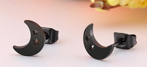 Macro shot of matte black crescent moon earrings with hollow star cutouts