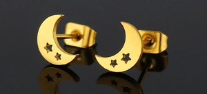 Close-up of golden stainless steel crescent moon earrings with hollow star details