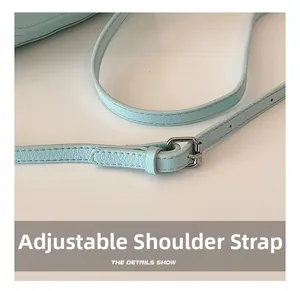 Detailed macro view of adjustable light blue lychee pattern leather shoulder strap
