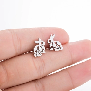 Macro shot of silver bunny stud earrings with intricate floral laser cutouts