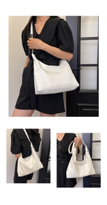 Detailed view of white lychee texture leather tote bag with silver chain strap details
