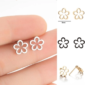 Detailed view of 8mm hollow flower stud earrings in silver, gold, and black finishes
