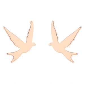 Detailed close-up of rose gold bird stud earrings featuring a minimalist swallow design