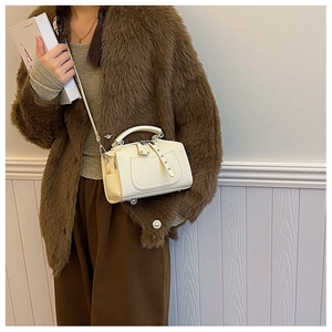 Creamy white Boston style handbag with lychee pattern texture and silver hardware