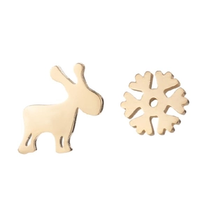 Macro detail of asymmetric gold reindeer and snowflake stainless steel stud earrings