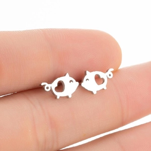 Cute minimalist pig stud earrings with heart cut-out in polished silver finish