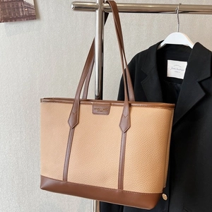 Brown contrast leather tote bag with lychee texture and dual shoulder straps for commute