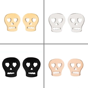 Detail view of hollow skull stud earrings in gold, silver, black and rose gold finishes