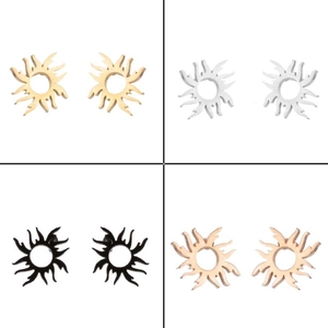 Detail of hollow sunburst stud earrings in gold, silver, black, and rose gold finishes