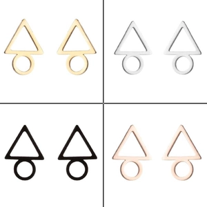 Detail of geometric triangle and circle stud earrings in gold, silver, black, rose gold