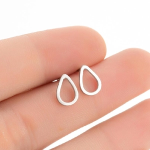 Close-up of minimalist silver water drop stud earrings in polished stainless steel
