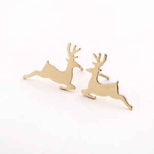 Macro shot of polished gold-plated stainless steel reindeer earrings on white background