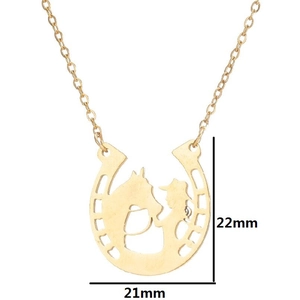 Golden horseshoe necklace with horse and cowboy silhouette pendant on white background