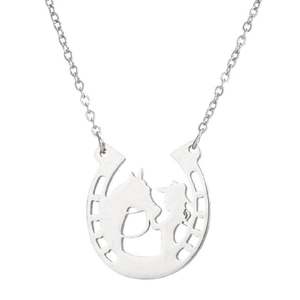 Detailed macro view of the silver horseshoe pendant with a horse and girl cutout