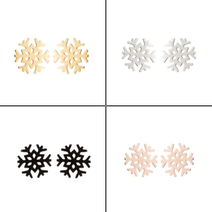 Detail of snowflake earrings set in gold, silver, black, and rose gold finishes