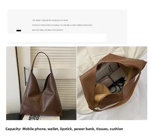 Detail view of large dark brown retro tote showing spacious interior for daily essentials
