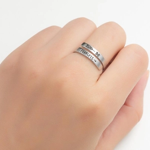 Polished stainless steel wrap ring featuring Be Fearless engraving and arrow details