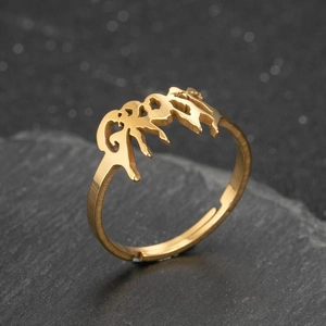 Vintage gothic gold molten texture open ring with letter G on a dark stone background