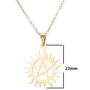 Macro shot of 22mm gold sun pendant with pentagram star and flame edges detail