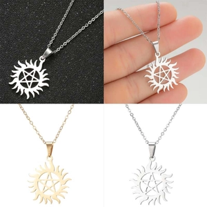 Detailed views of gold and silver pentagram sun symbol pendants on stainless steel chains