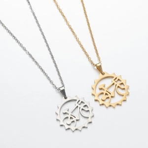 Detailed shot of hollow industrial gear and bicycle pendants in gold and silver finish