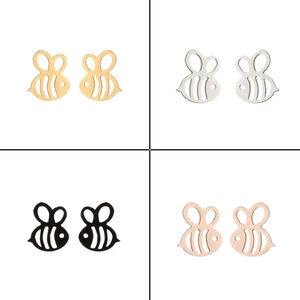 Detailed view of hollow bee stud earrings in gold, silver, black and rose gold steel
