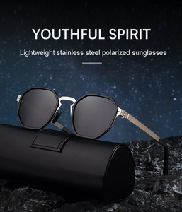 Polarized polygon sunglasses on a black leather case with a starry night background