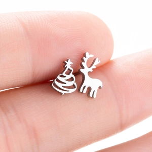 Asymmetric silver reindeer and Christmas tree stud earrings set in minimalist design