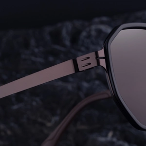 Macro shot of screwless metal hinge on square polarized sunglasses for men