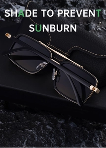 Detail of polarized sunglasses with black square frame and gold metal hinges on leather case