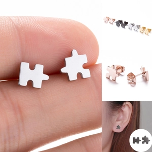 Polished geometric puzzle piece stud earrings for men and women in four metallic finishes