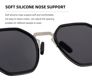 Detail of adjustable soft silicone nose pads on black polarized hexagonal sunglasses