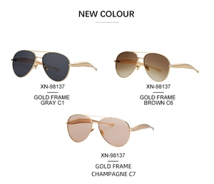 Three pairs of vintage aviator metal sunglasses in gold frames with multi-color lenses