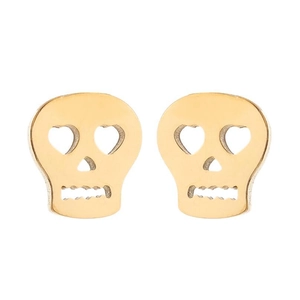 Detail of gold skull stud earrings with heart-shaped eyes and hollow nose design