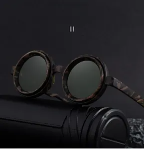 Macro shot of round camouflage frame sunglasses with dark gray polarized lenses