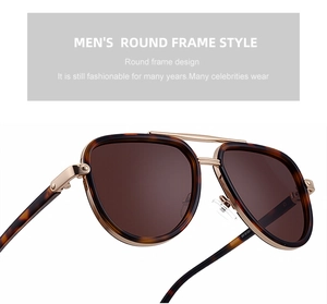Macro detail of men's aviator sunglasses featuring tortoise frames and golden metal bridge