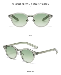 Détail de lunettes de soleil rondes rétro vert clair avec charnières et verres dégradés