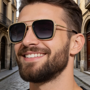 Close-up of pilot sunglasses featuring a gold metal frame and stylish double bridge