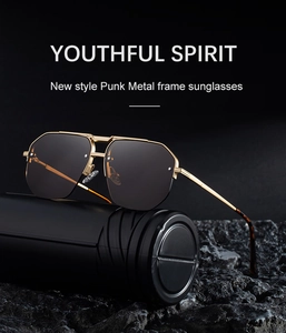 Detail of punk style sunglasses with gold metal frame and irregular polygonal lenses