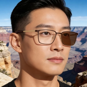 Detail of square photochromic sunglasses with metal temples on model in nature