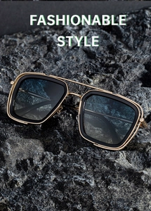 Detail of square gold metal and black composite frame sunglasses with gradient blue lenses