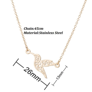 Golden stainless steel hummingbird pendant necklace with intricate cut-out patterns