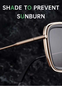 Detail of gold metal hinge and hollow temples on black square retro sunglasses